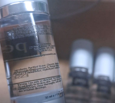 small text printing on cosmetics bottles
